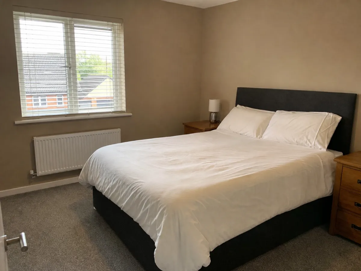 Bedroom with new wall color and wooden floor